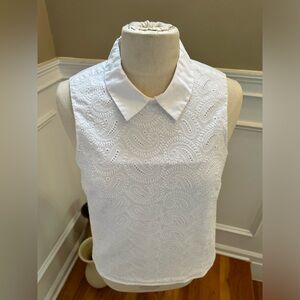 White sleeveless collard top